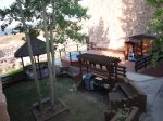 Outdoor common area with grills, gazebo, and sunken hot tub